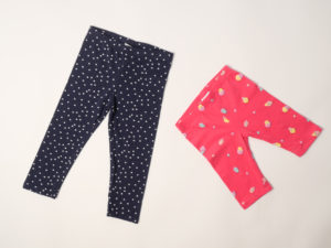 Navy blue pants with love hearts in white and a pink shory with ice cream cones