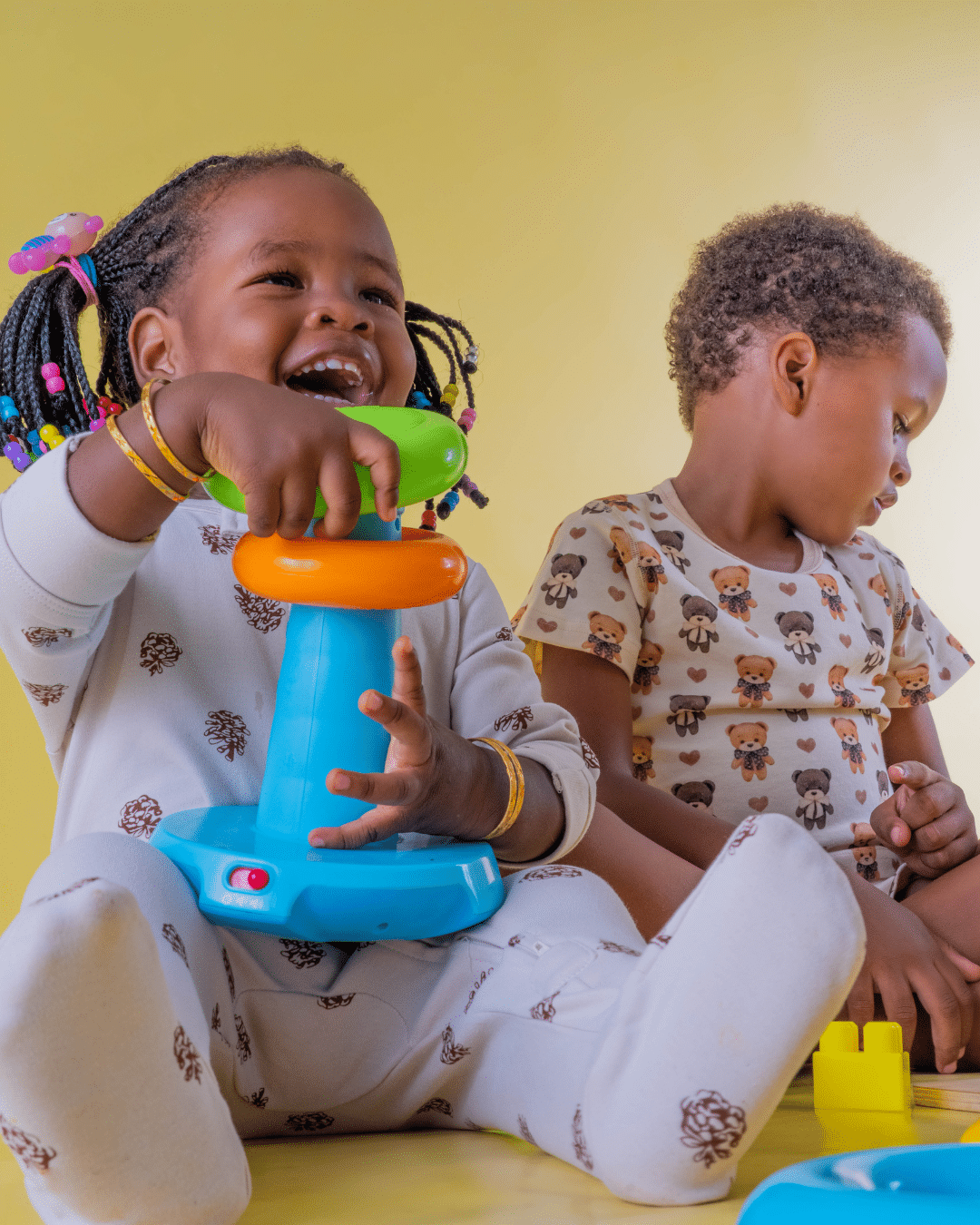 2 kids playing wearing baby step boutique clothes